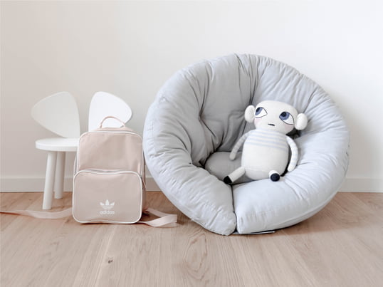 Children's bean bags in many different shapes and colors, for playing and cuddling.