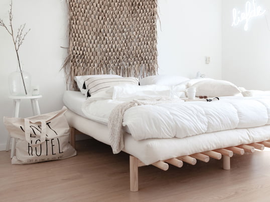 Pace bed from Karup Design in the ambience view. Due to the simple, restrained design, the bed fits perfectly into any living ambience.