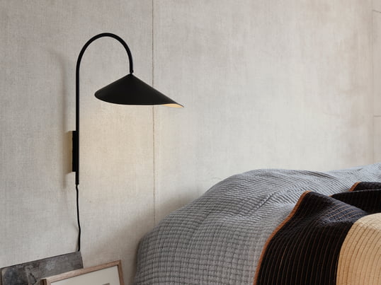 Arum Wall lamp in black from ferm Living in the ambience view. Perfect as a small night light next to the bed or ambient light in the hallway or living room.