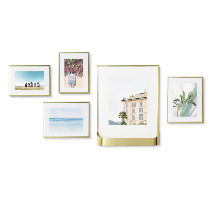The Matinee picture frame set from Umbra , 5 frames in 3 sizes, 1 with shelf, brass