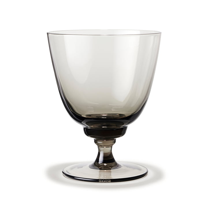 Flow Drinking glass with base with Holmegaard in the color smoke