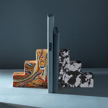 Swirl bookends by Tom Dixon in different versions