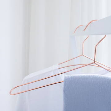 Filigree copper coat hangers in a set