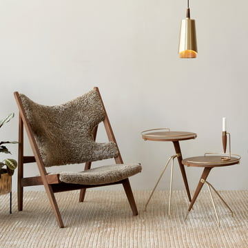 Lounge armchair with sheepskin and side tables in walnut