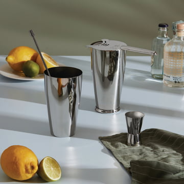 The Boston cocktail set from Alessi in stainless steel next to limes and gin