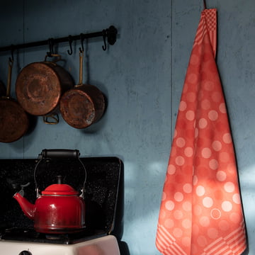 The red tea towel from Weltevree hung on the wall in the kitchen