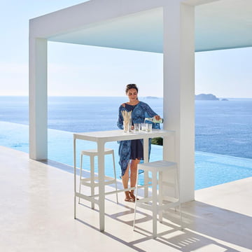 The Cut bar stool and bar table from Cane-line by the pool