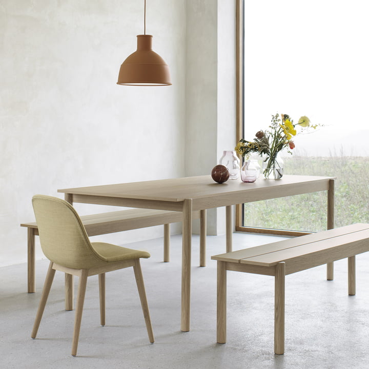 Linear Wood dining table and bench as well as Unfold pendant lamp by Muuto
