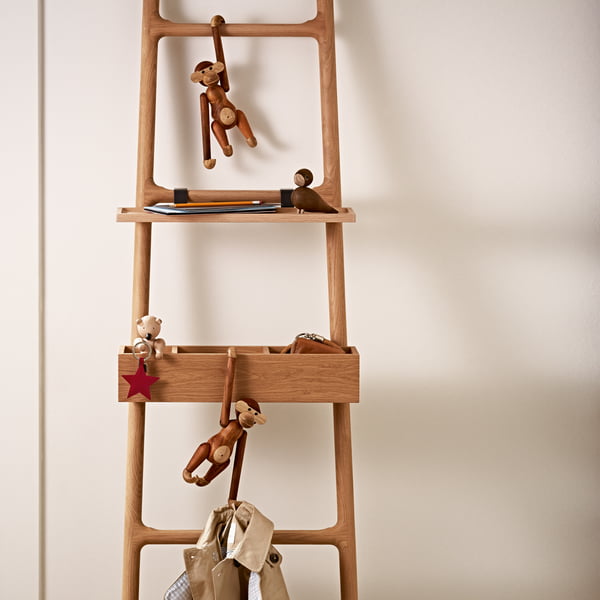 Wooden monkey, the bear and lovebirds by Kay Bojesen on a ladder