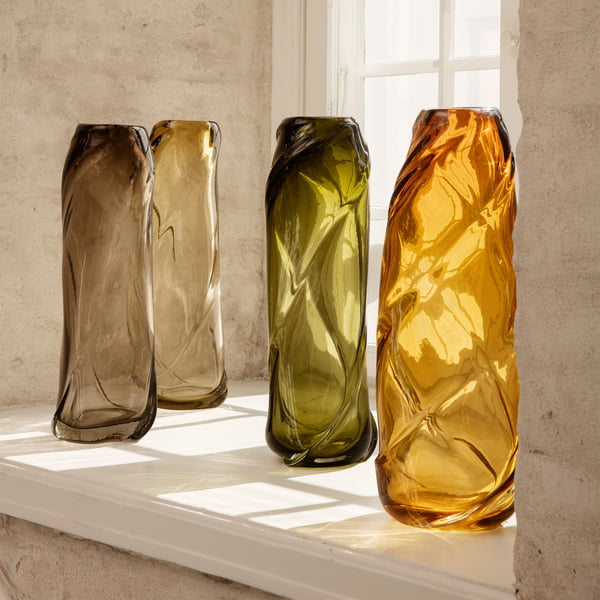 The Water Swirl vase from ferm Living in its different colors on the windowsill