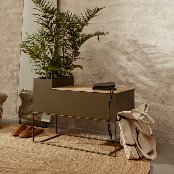 The large Plant Box by ferm Living with an indoor palm tree and everyday objects in the hallway